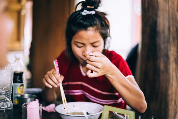 people, woman, asian, chopsticks, noodles, ramen, condiments, bowl, soup